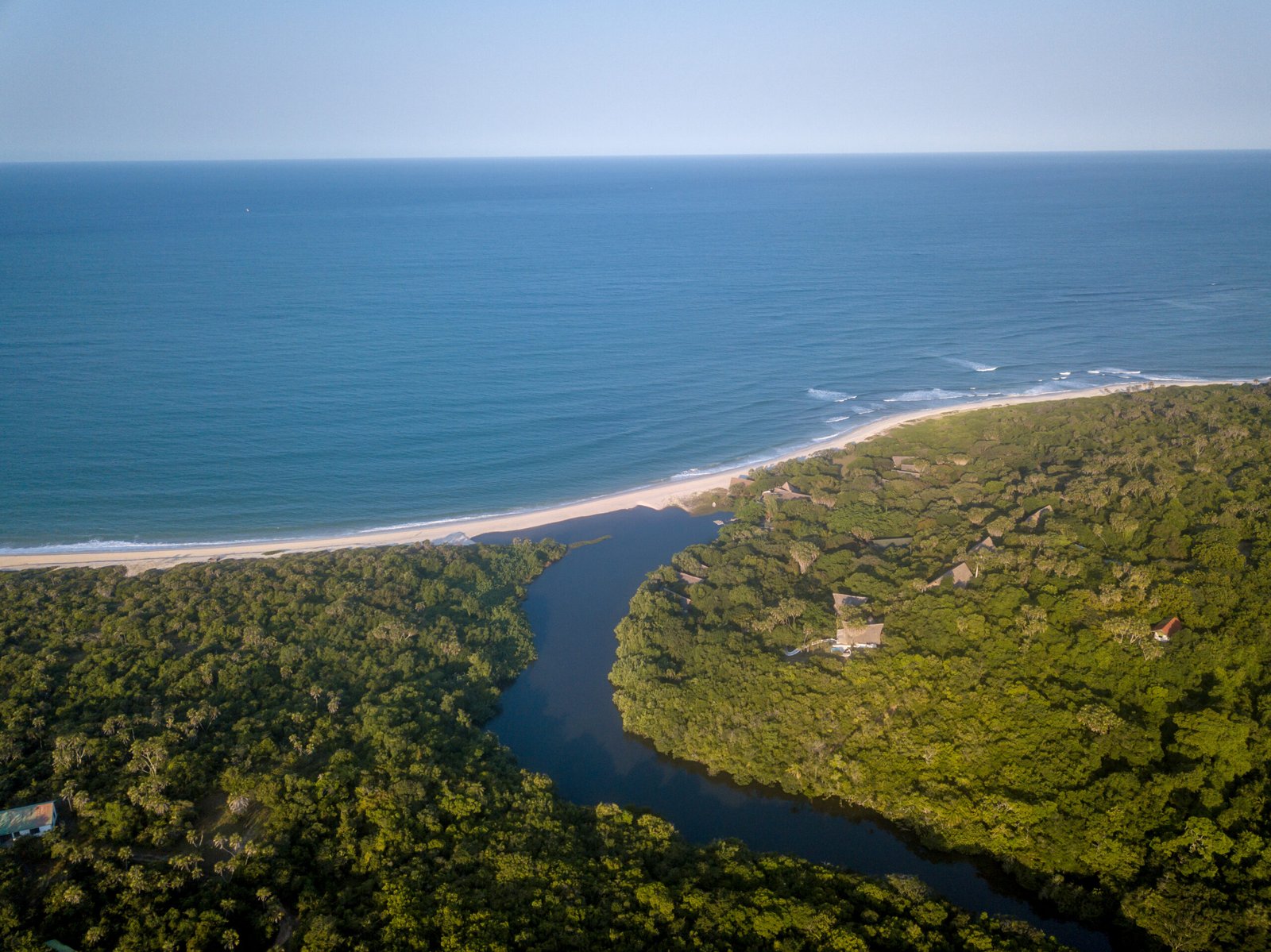 Drone picture of a lagoon in a coastal forest.